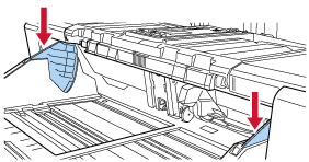 按下在送纸器侧导板上上下移动的部件